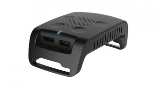 The transmission module of the TPCAST accessory seen sporting HDMI and USB ports
